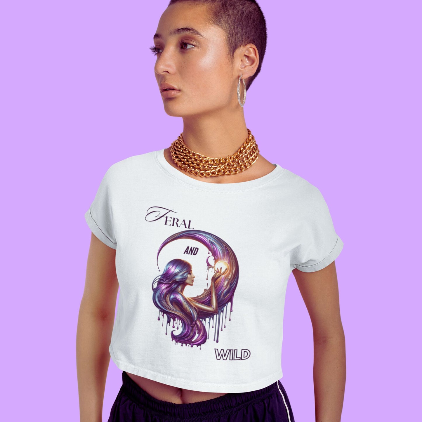 Feral and wild crop top in white, made from organic cotton. Model in short hair showcasing the front view of the crop top in a studio setting.