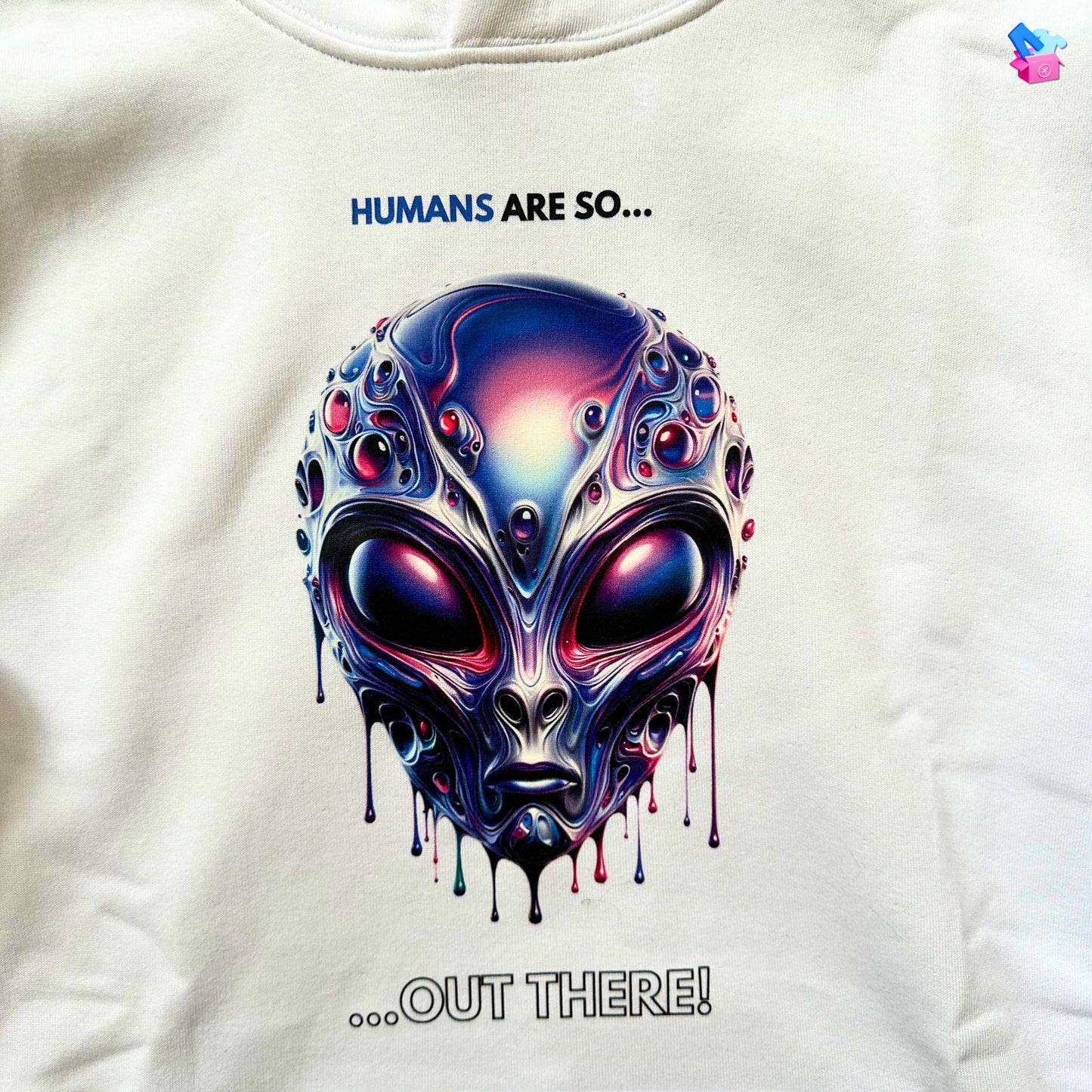 Humans are so out there Alien Hoodie in white, made from organic cotton. Close up of fabric and front print.