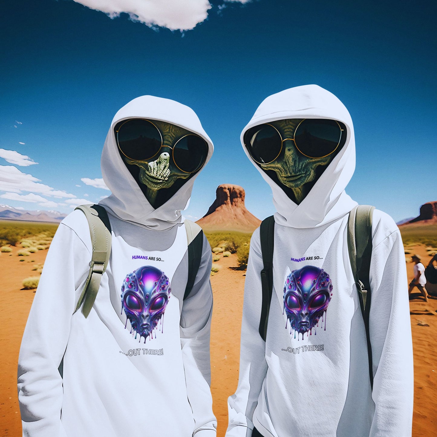 Humans are so out there Alien Hoodie in white, made from organic cotton. Two aliens in sunglasses showocasing the hoodie in the desert.