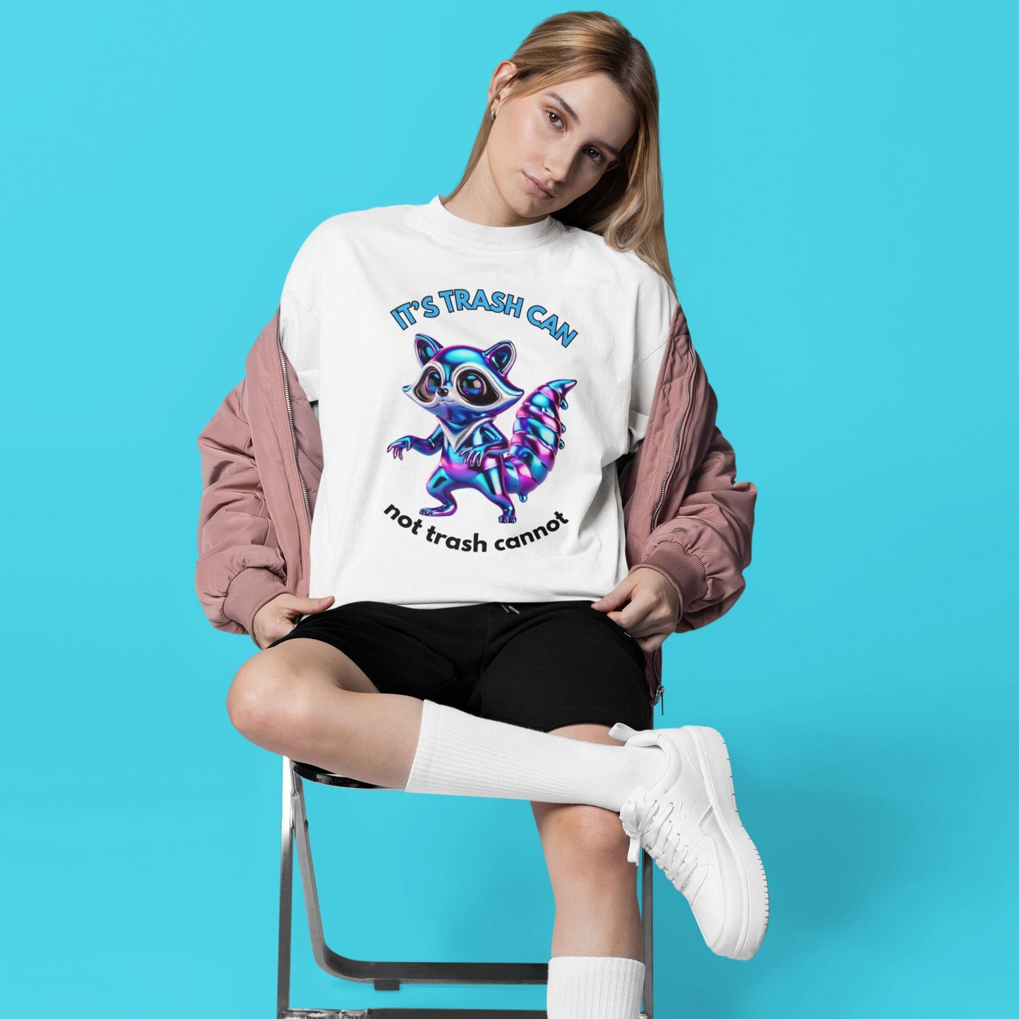 It’s trash can not trash cannot Raccoon Shirt in white, made from organic cotton. Model showing front view print.