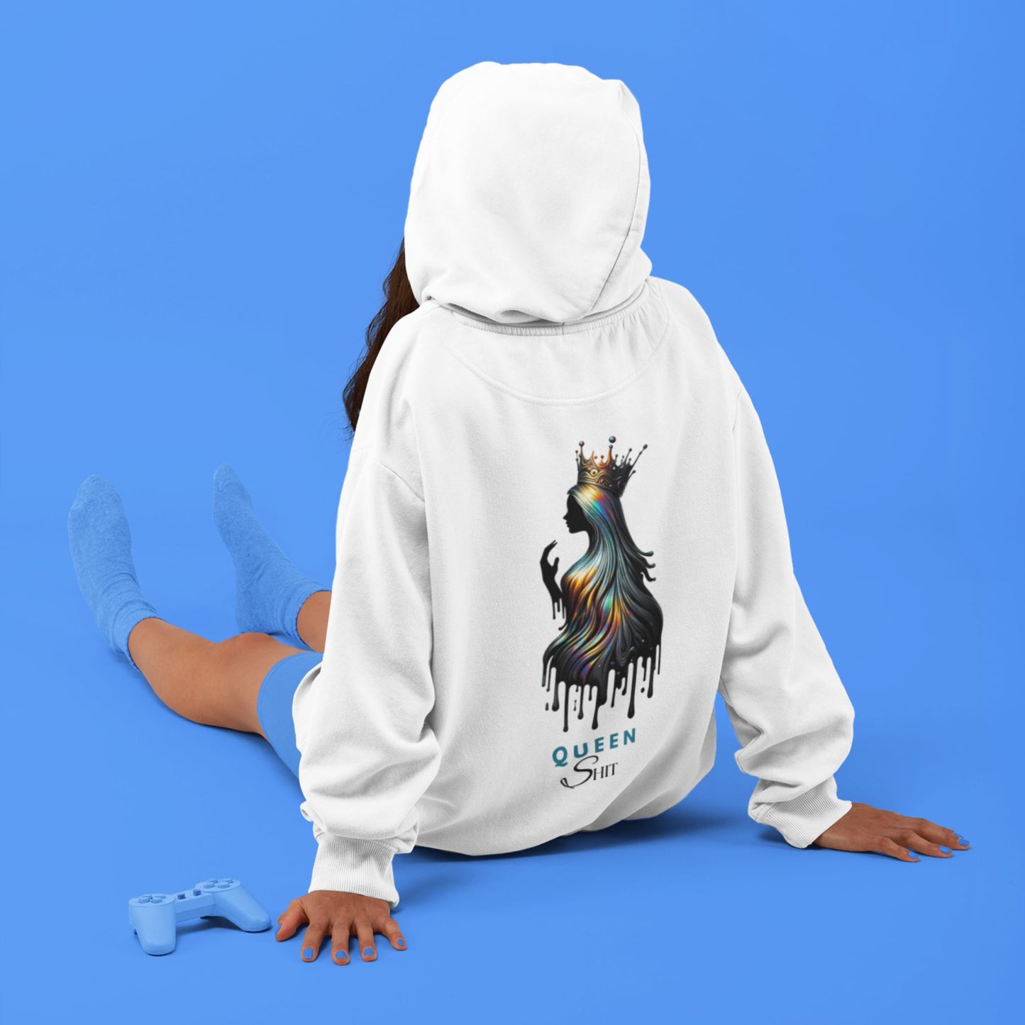 Queen Shit Hoodie in white, made from organic cotton. Model sitting on the ground showcasing the back view.
