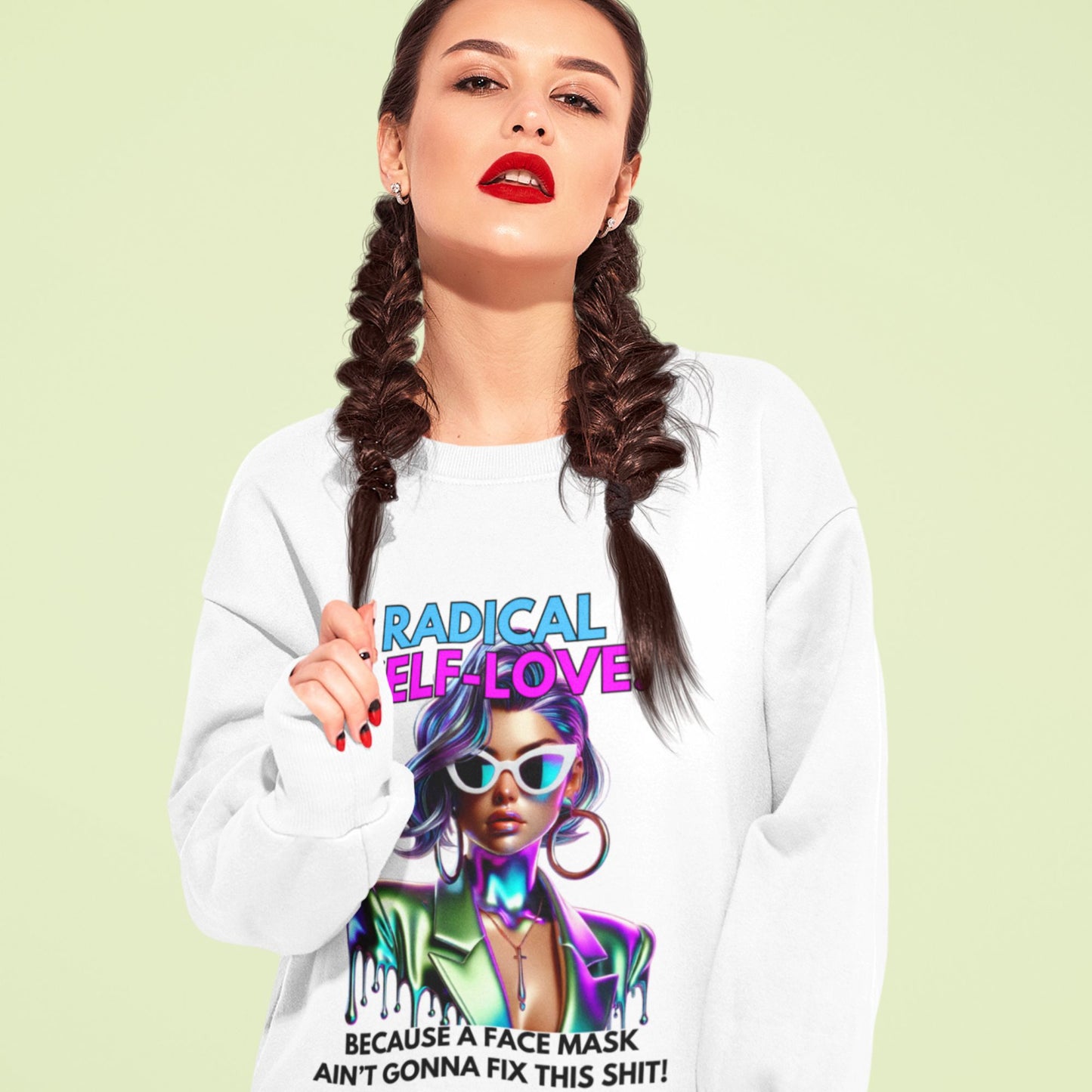 Radical self-love Sweatshirt in white, made from organic cotton. Model showcasing front view in sitting position.