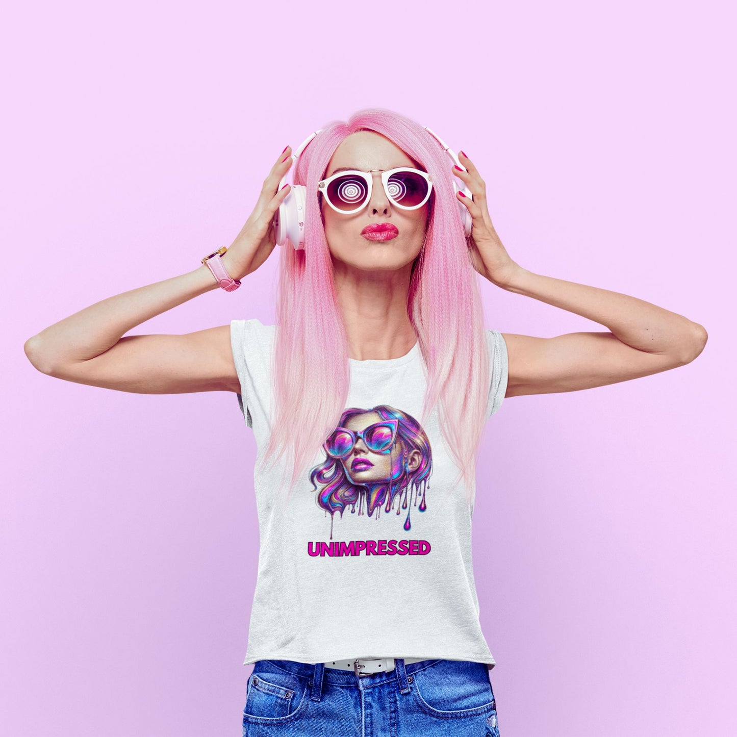 Unimpressed Shirt in white, made from organic cotton. Model showing front view in a studio setting on a pink background.
