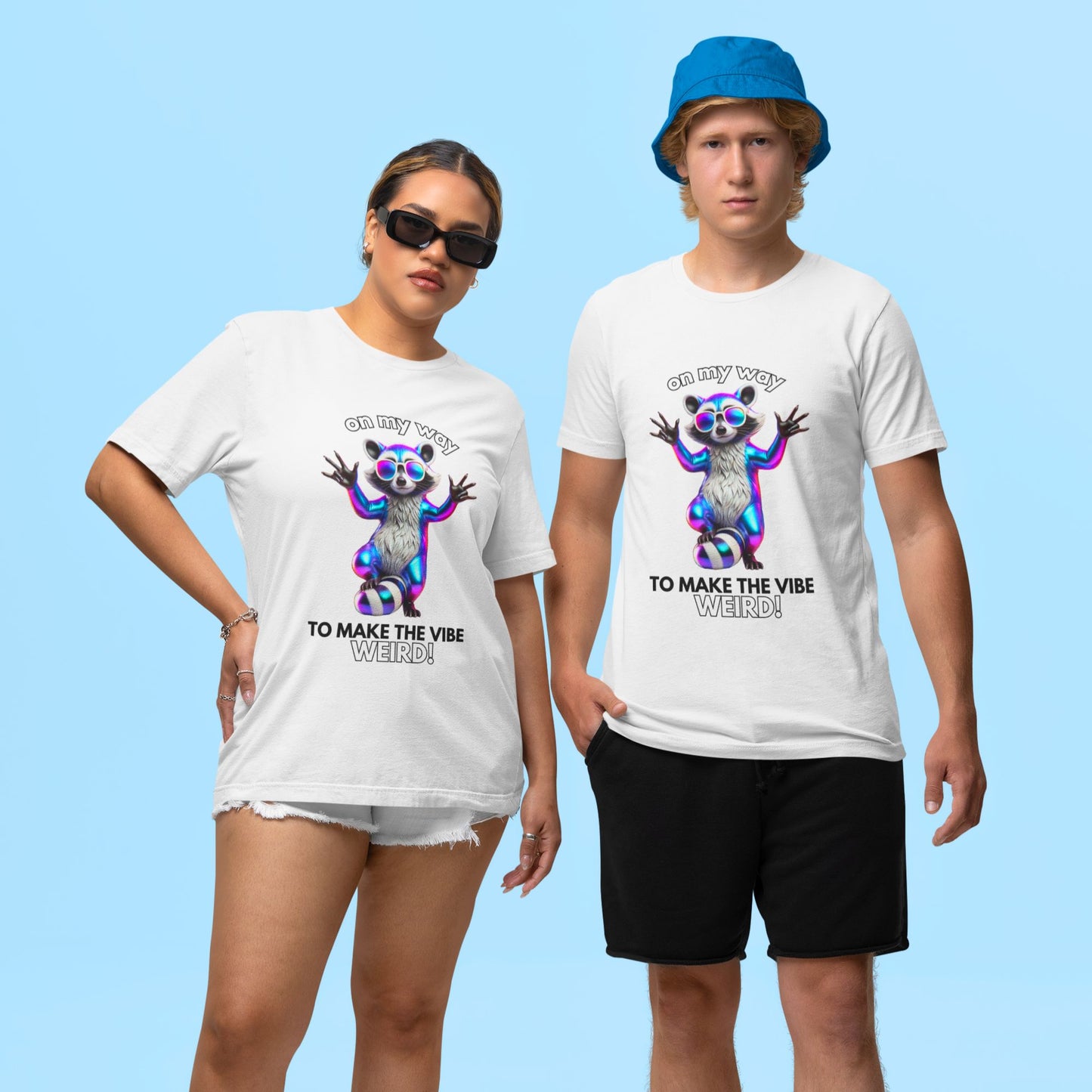 On my way to make the vibe weird Raccoon Shirt in white, made from organic cotton. Female and male model showcasing front view print.