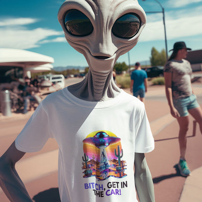 Bitch, get in the car Alien Abduction Shirt in white, made from organic cotton. Friendly alien modeling the shirt in a lifestyle setting.