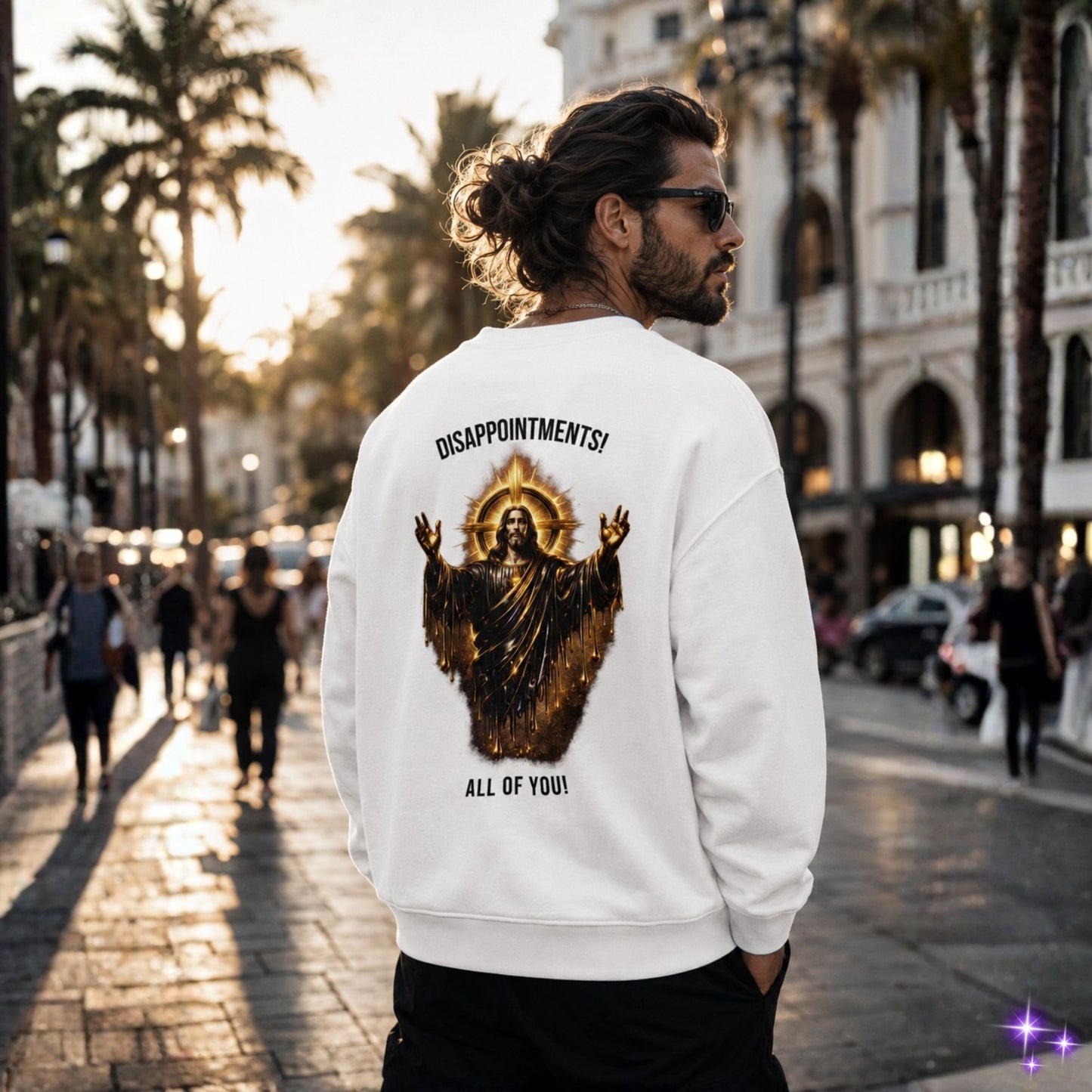 Man wearing a white sweatshirt with a graphic design and text on a city street.