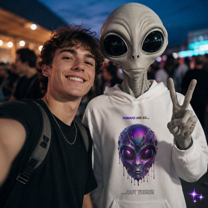 Person taking a selfie with an alien wearing a hoodie with an alien design.