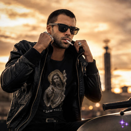 Man wearing sunglasses and a black jacket with a graphic design, standing against a sunset or sunrise background.