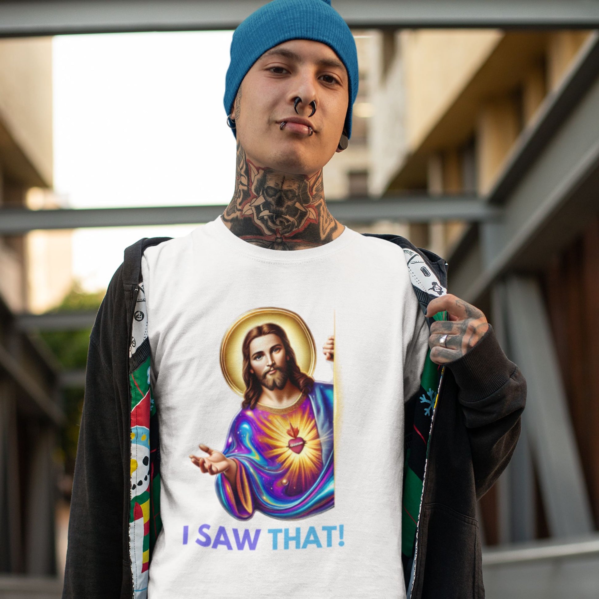 I saw that Jesus Shirt in white, made from organic cotton. Male model with tattoos showcasing shirt in a lifestyle setting.