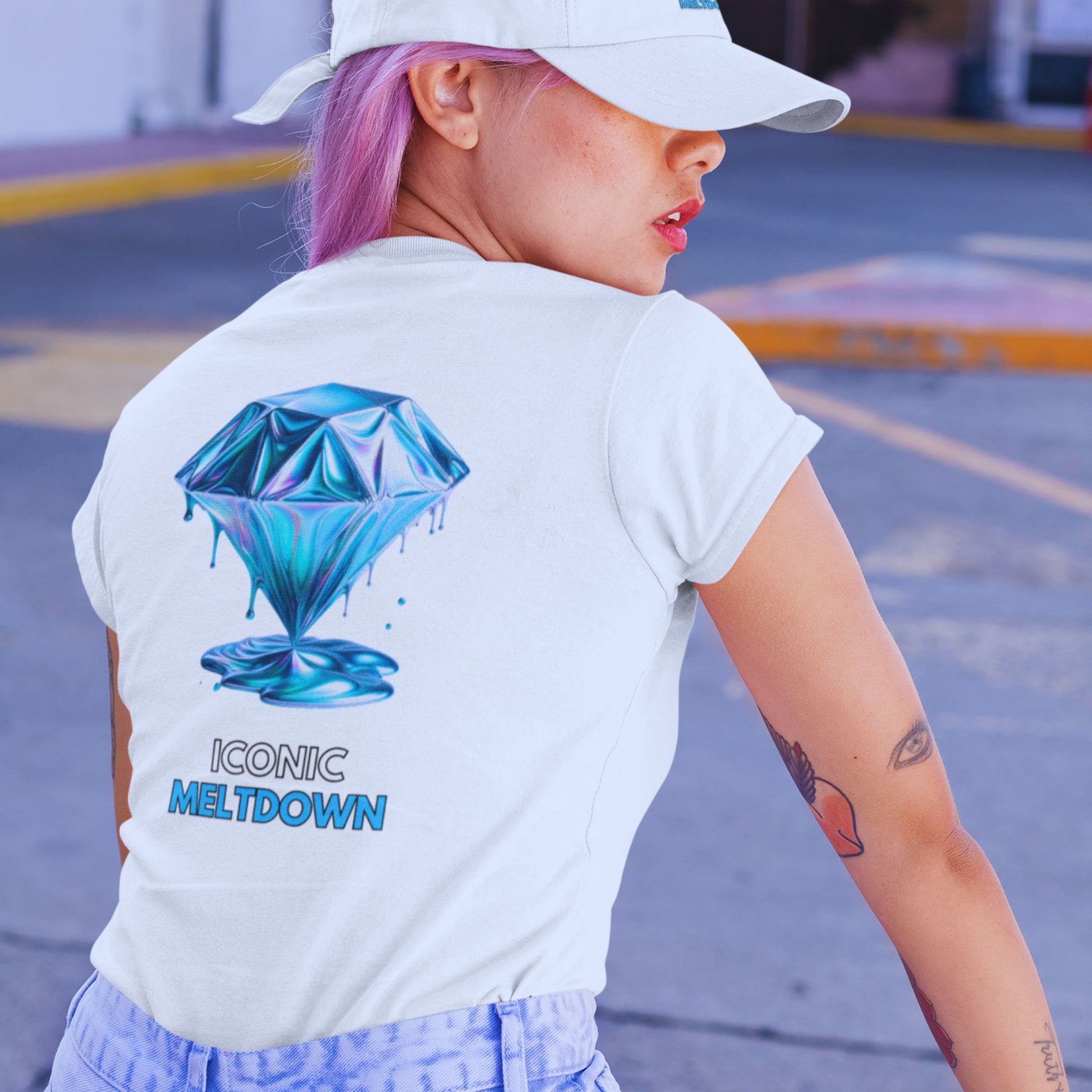 Iconic Meltdown Shirt showcasing the image of a melting diamond in white, made from organic cotton in conversion. Model in lifestyle setting showcasing the shirt from the back.