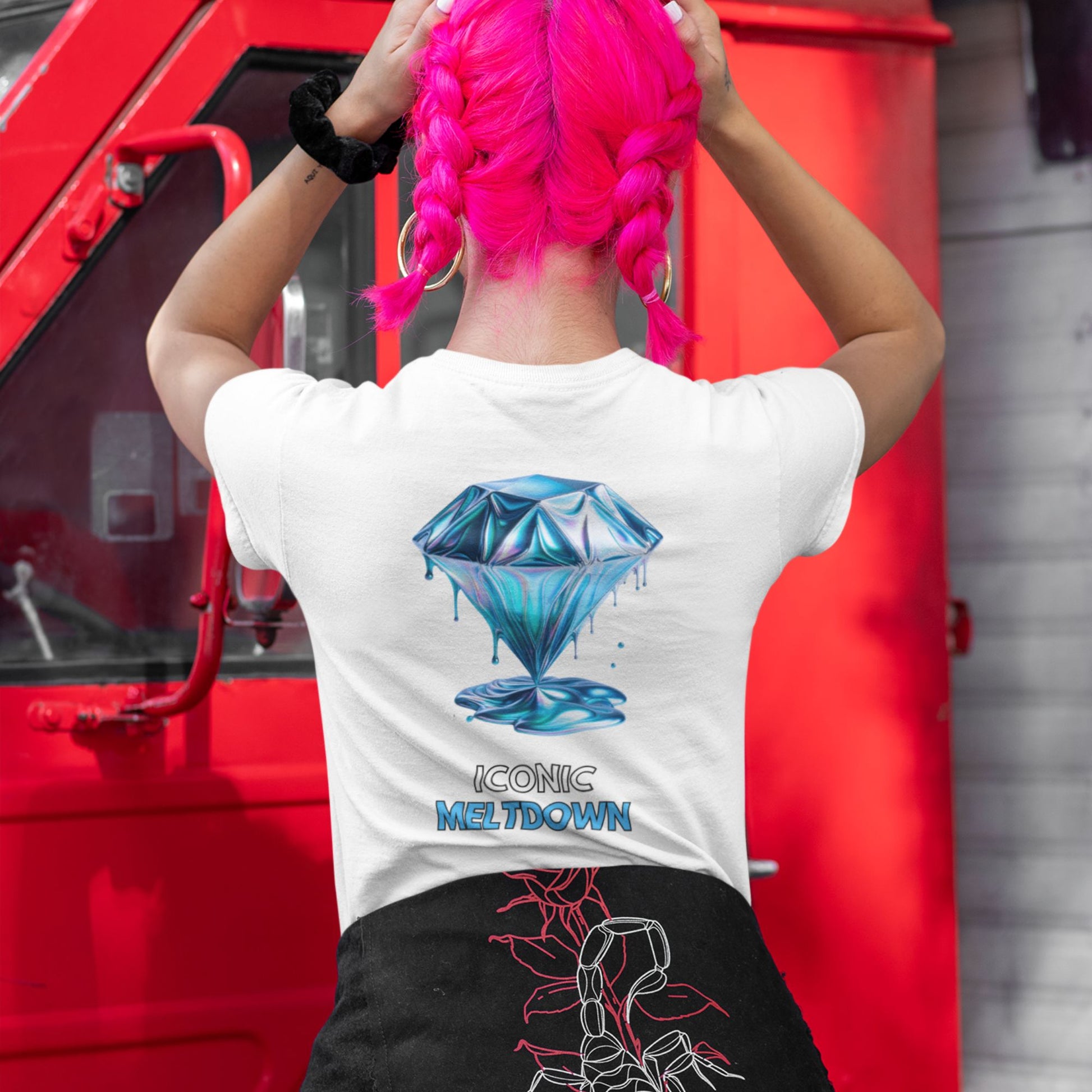 Iconic Meltdown Shirt showcasing the image of a melting diamond in white, made from organic cotton in conversion. Model with pink hair showcasing hirt in a lifestyle setting.