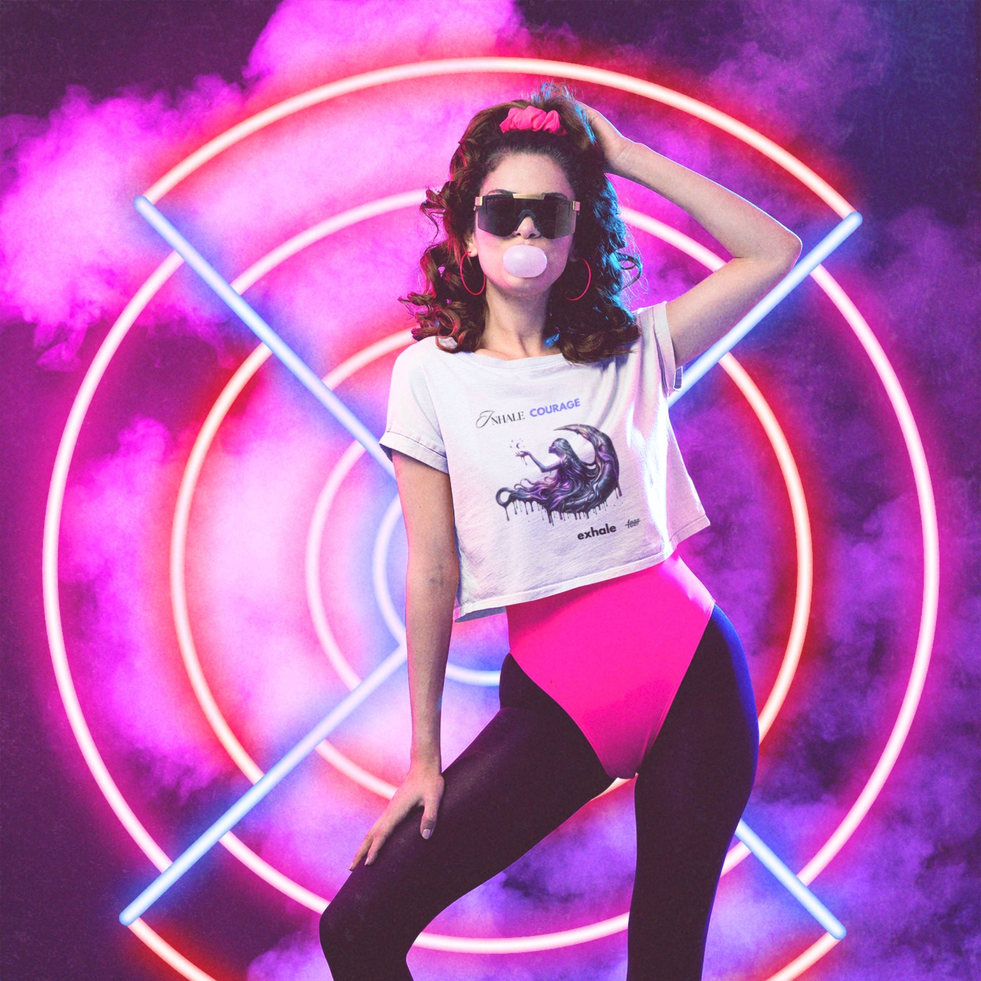 Inhale courage exhale fear crop top in white, made from organic cotton. Model showcasing crop top in an 80s inspired setting.