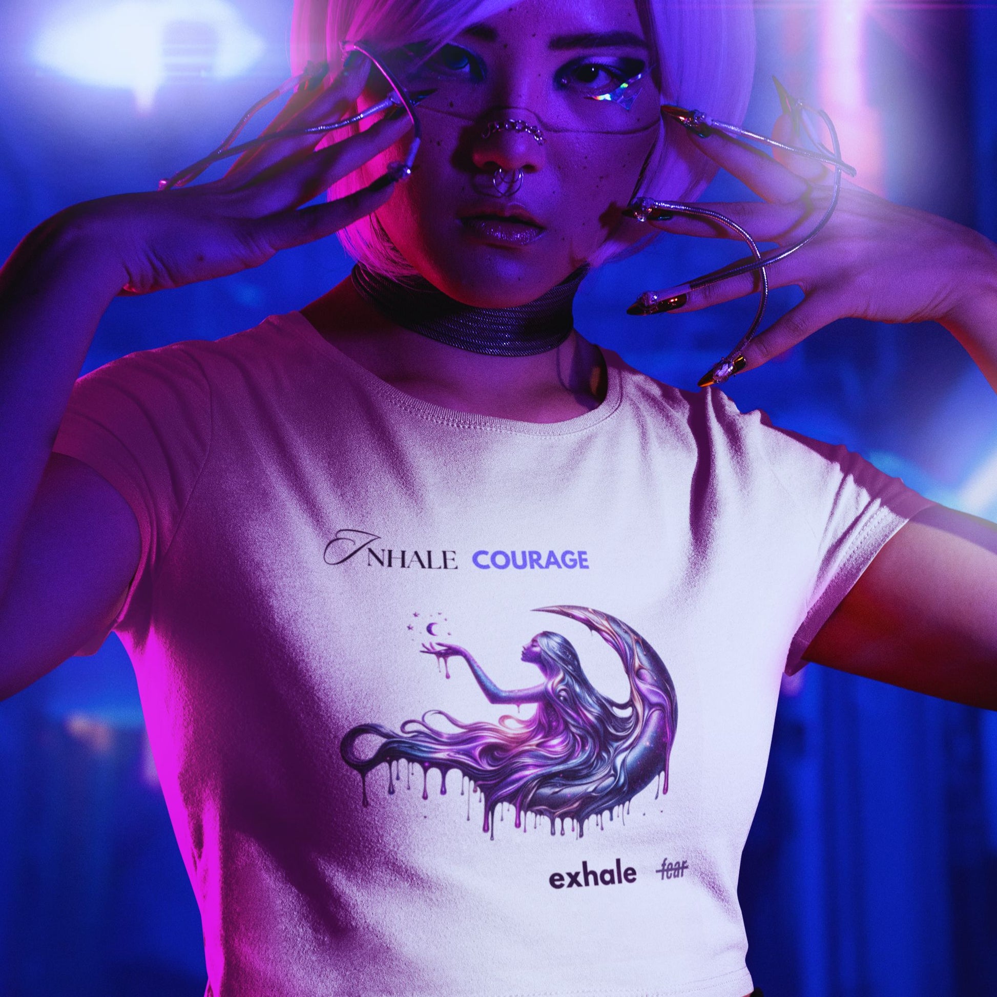 Inhale courage exhale fear crop top in white, made from organic cotton. Cyber punk inspired female model showcasing the crop top in futuristic setting.