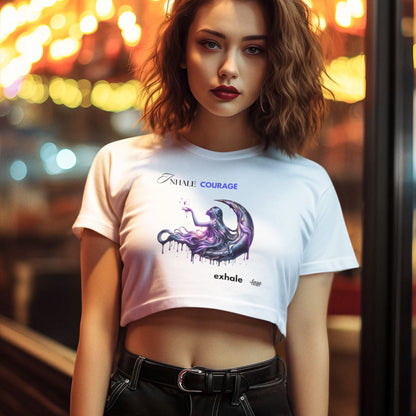 Inhale courage exhale fear crop top in white, made from organic cotton. Female model showcasing the crop top in a lifestyle setting.