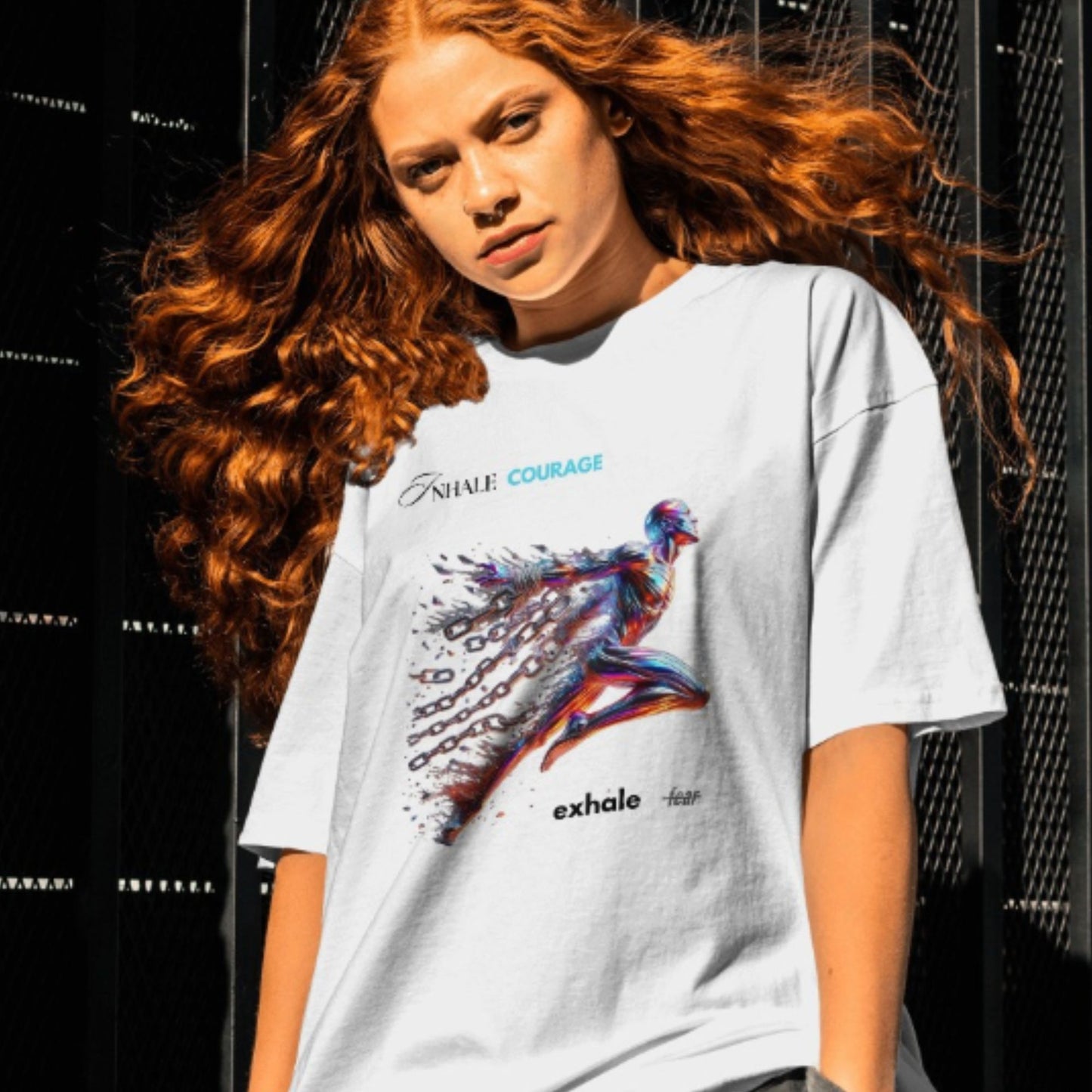 Inhale courage exhale fear Shirt in white, made from organic cotton in conversion. Front view showcased by a red haired female model in a lifestyle setting.