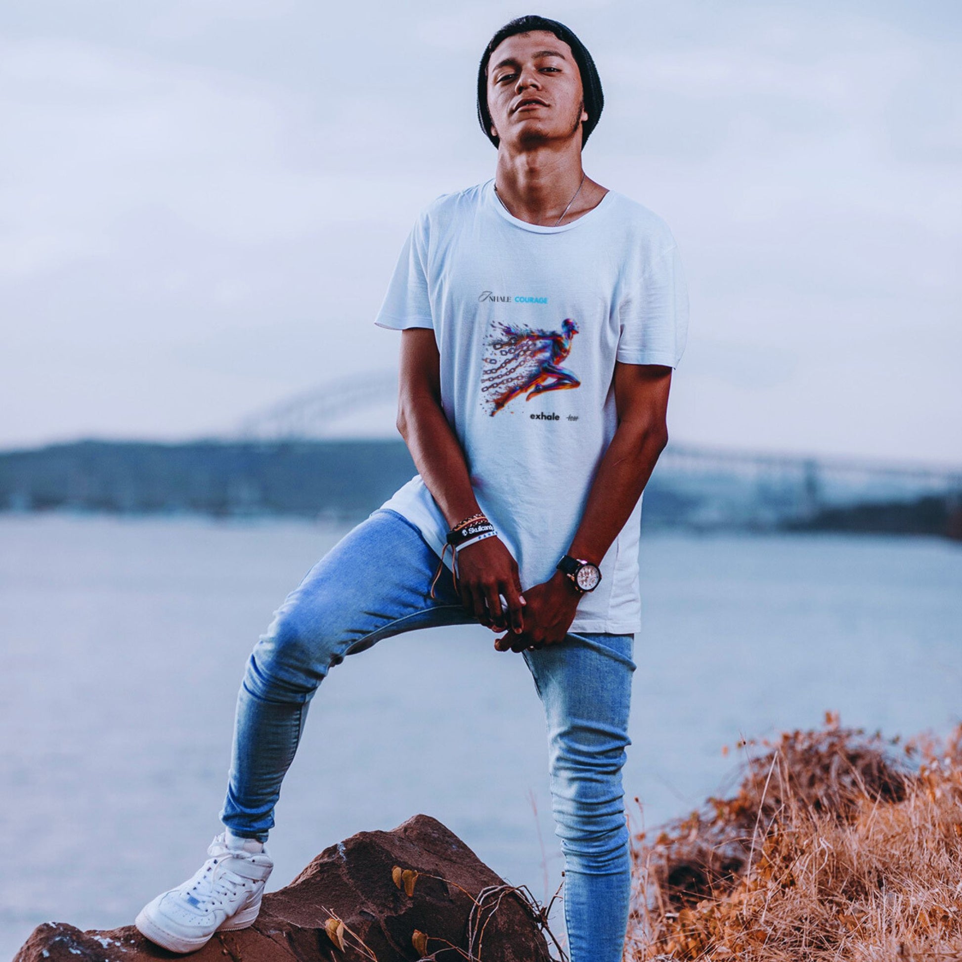Inhale courage exhale fear Shirt in white, made from organic cotton in conversion. Male model showcasing the shirt in nature.