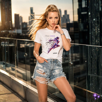Woman in a white t-shirt and denim shorts standing on a rooftop with city skyline in the background