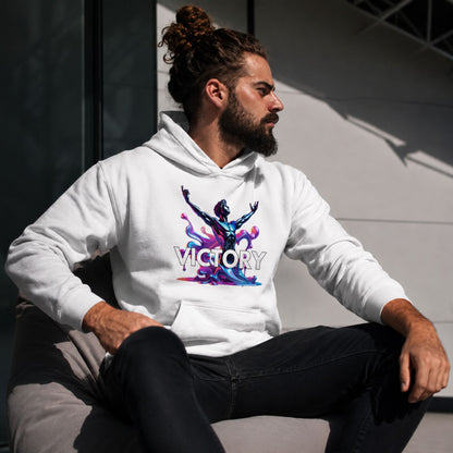 Man wearing a white hoodie with 'VICTORY' design sitting outdoors.