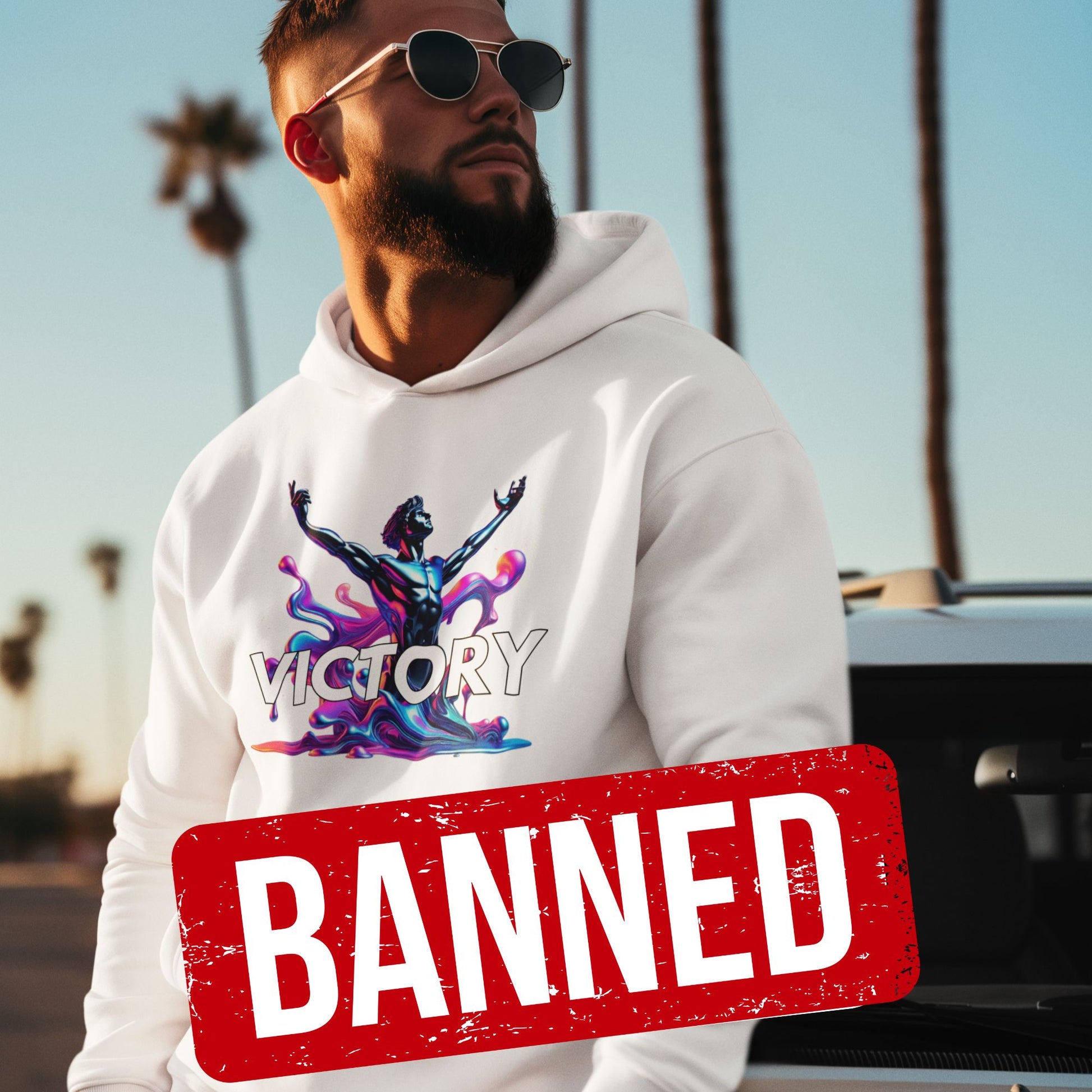 Victory Hoodie in white, made from organic cotton. Male model in lifestyle setting showcasing the hoodie. 