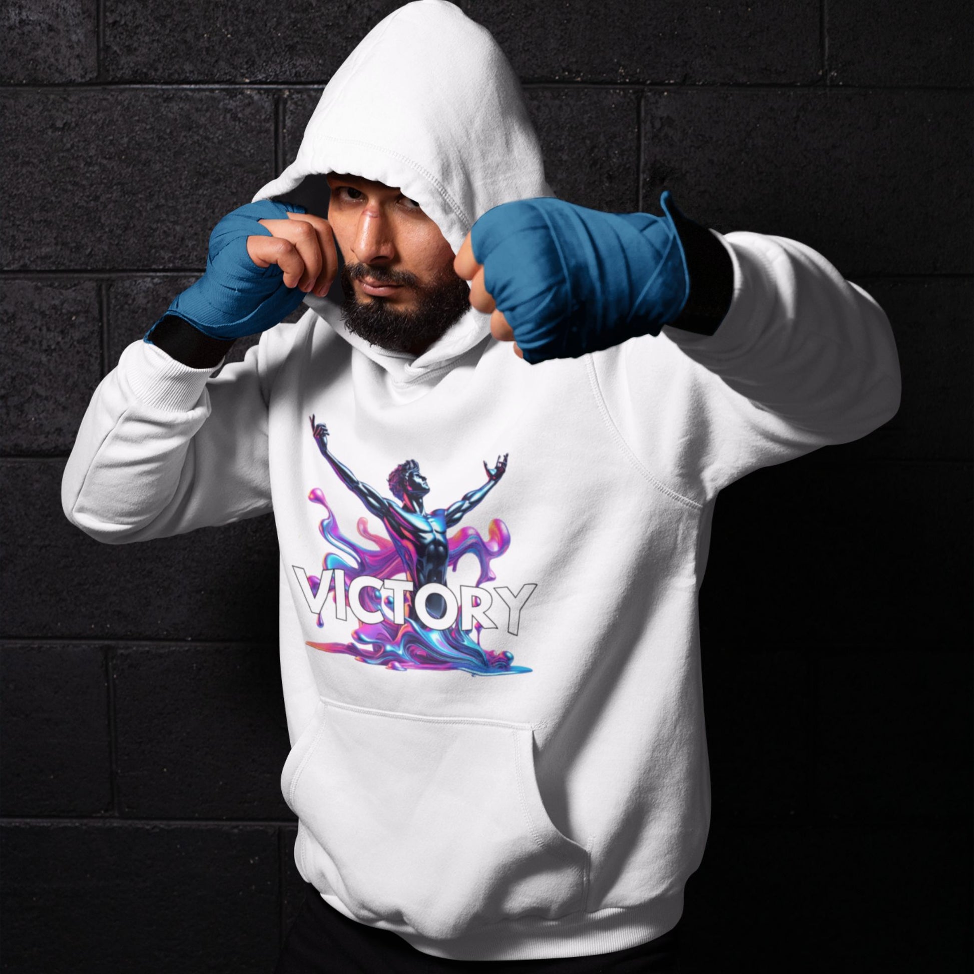 Victory Hoodie in white, made from organic cotton. Male model in sportswear showcasing hoodie.