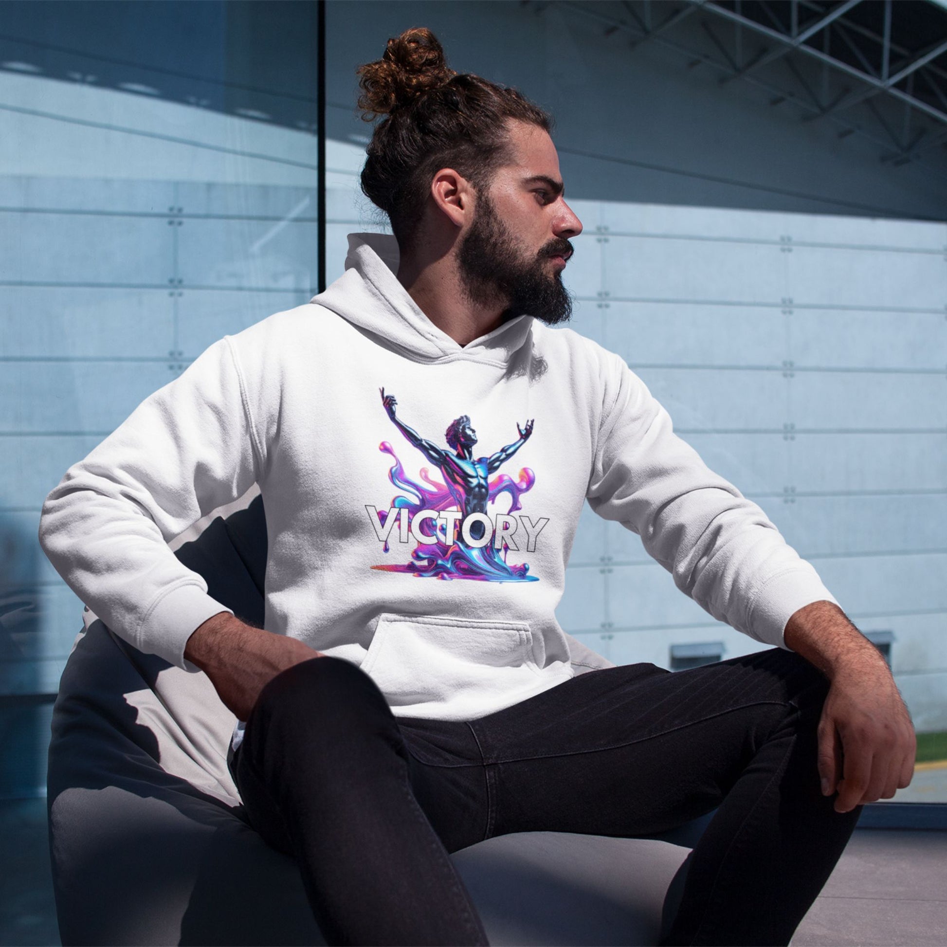 Victory Hoodie in white, made from organic cotton. Male model showcasing hoodie in lifestyle setting. 