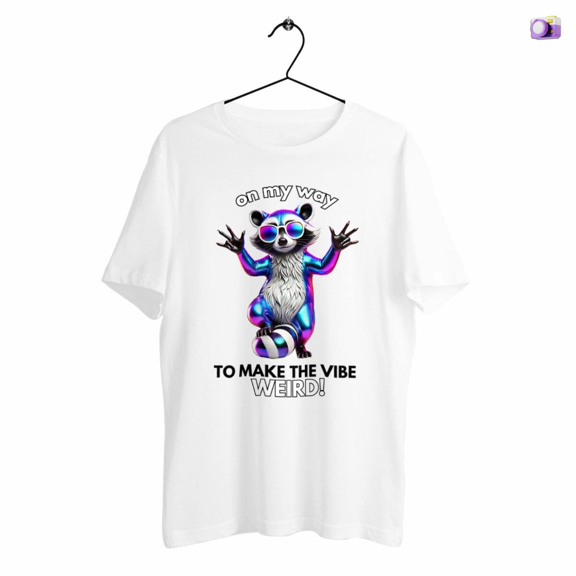 On my way to make the vibe weird Raccoon Shirt in white, made from organic cotton. Front view showing print. Shirt showcased on a hanger.